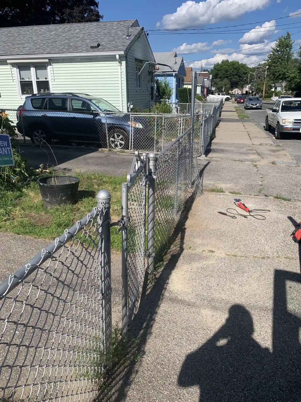 Chain link fence along a residential driveway in Massachusetts